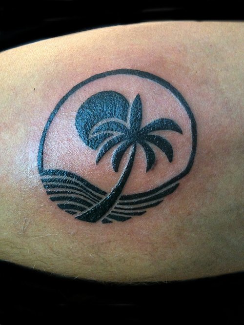 Sun and Palm Tree Tattoo